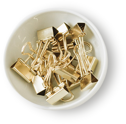 Bowl with Gold Paper Clips Isolated on White